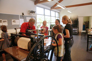 Working at the press.